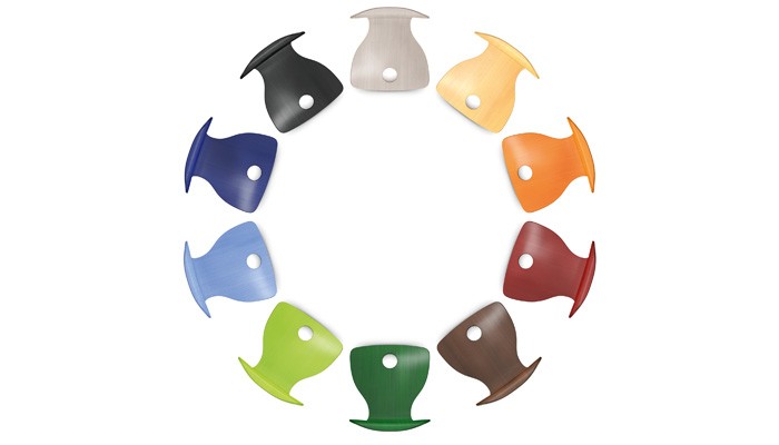 Eleven plywood chair shell finishes arranged in a colour wheel
